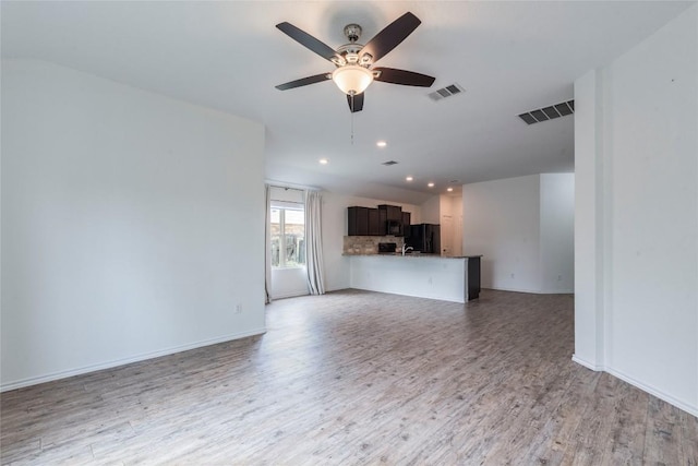 1713 Pahmeyer Path, New Braunfels, TX 78130 - unfurnished living room featuring a ceiling fan, light wood-style floors, and recessed lighting