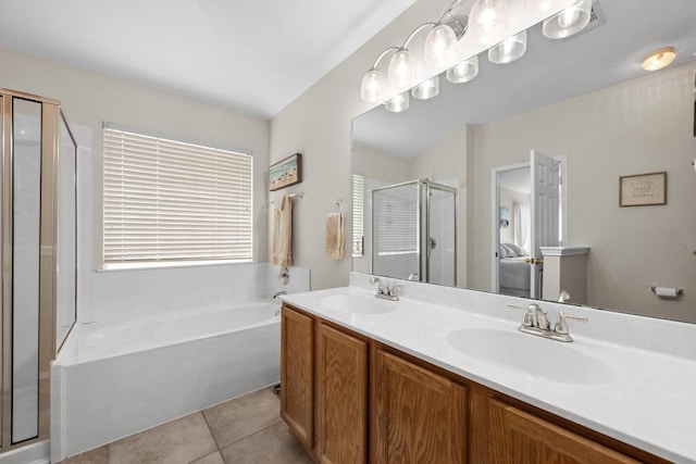 1012 Peyton Pl, Cedar Park, TX 78613 - full bath featuring a shower stall, a bath, double vanity, and tile patterned floors
