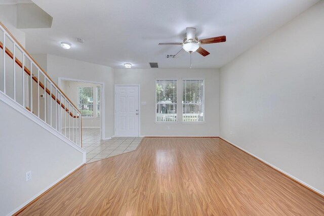 1012 Peyton Pl, Cedar Park, TX 78613 - foyer featuring stairway, ceiling fan, and wood finished floors
