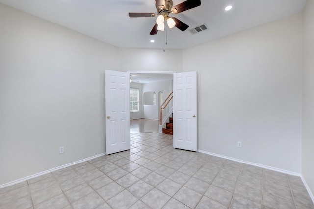 1012 Peyton Pl, Cedar Park, TX 78613 - spare room with a ceiling fan, recessed lighting, stairway, baseboards, and light tile patterned flooring
