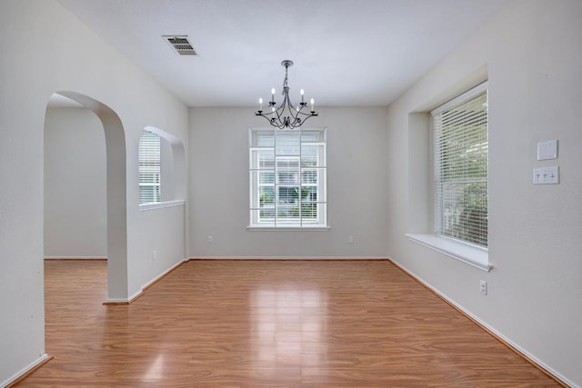 1012 Peyton Pl, Cedar Park, TX 78613 - empty room with a chandelier and wood finished floors