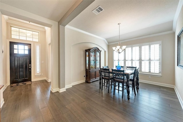 598 Jacksdaw Dr, Austin, TX 78737 - dining room with a chandelier, baseboards, ornamental molding, and dark wood-style flooring