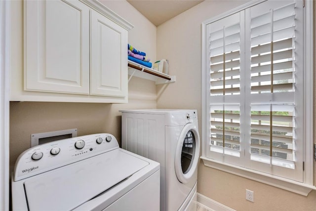 598 Jacksdaw Dr, Austin, TX 78737 - laundry area with washing machine and clothes dryer, cabinet space, and baseboards