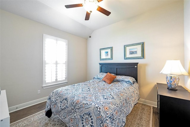 598 Jacksdaw Dr, Austin, TX 78737 - bedroom with multiple windows, baseboards, wood finished floors, a ceiling fan, and vaulted ceiling