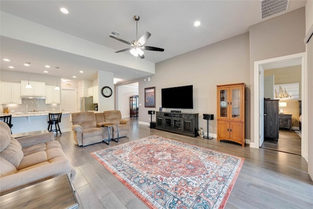 598 Jacksdaw Dr, Austin, TX 78737 - living area featuring ceiling fan, light wood finished floors, baseboards, and recessed lighting