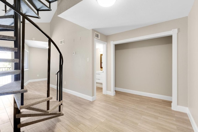 1840 Burton Dr Unit 167, Austin, TX 78741 - stairway with baseboards and wood finished floors