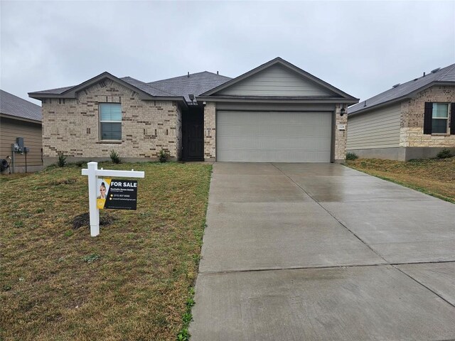 1124 Velvet Ct, Troy, TX 76579 - single story home featuring a garage, concrete driveway, a front yard, and brick siding