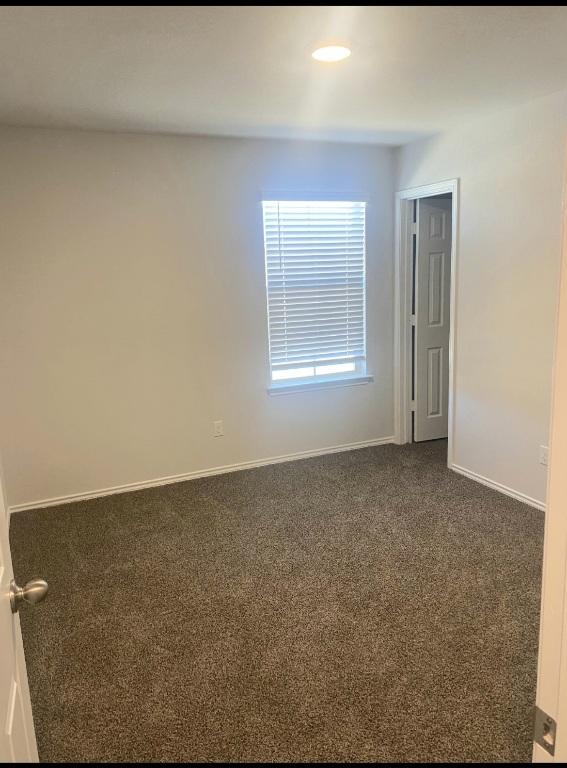 1124 Velvet Ct, Troy, TX 76579 - unfurnished room with dark carpet