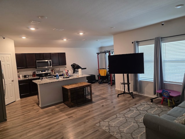 1124 Velvet Ct, Troy, TX 76579 - living area featuring light wood-style flooring and recessed lighting