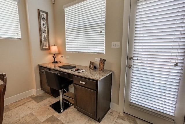 11913 Natures Bnd, Austin, TX 78753 - office area featuring baseboards and light stone finish floors