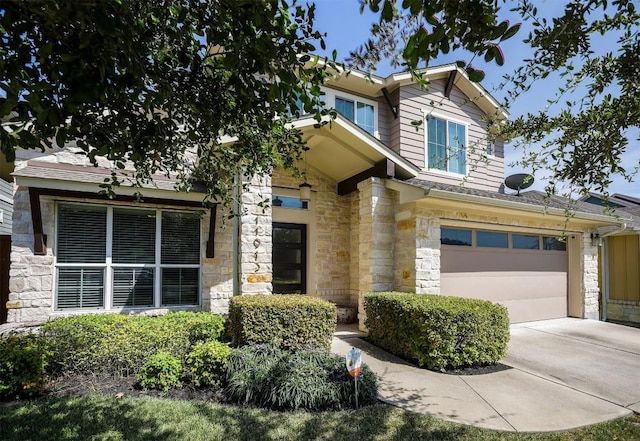 11913 Natures Bnd, Austin, TX 78753 - view of front of house featuring stone siding, driveway, and a garage