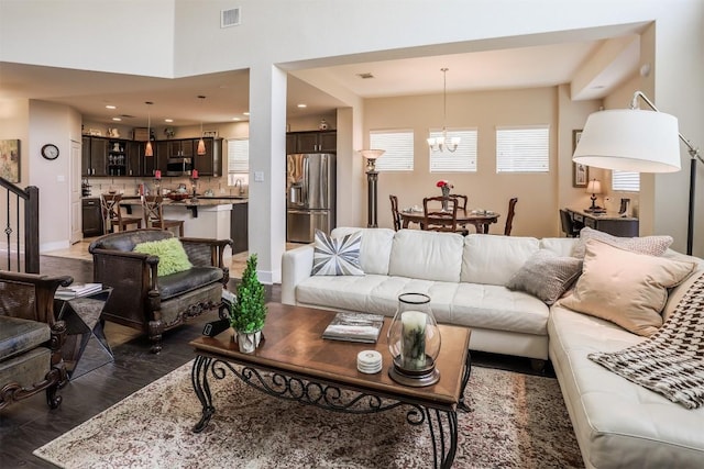 11913 Natures Bnd, Austin, TX 78753 - living room with a chandelier and dark wood-style flooring