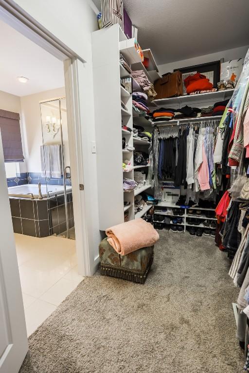 11913 Natures Bnd, Austin, TX 78753 - walk in closet with a chandelier and carpet