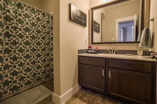11913 Natures Bnd, Austin, TX 78753 - bathroom with double vanity, tile patterned flooring, and curtained shower