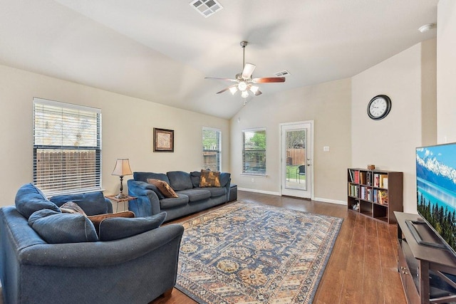1411 Rowan Dr, Georgetown, TX 78628 - living room with lofted ceiling, healthy amount of natural light, ceiling fan, and wood finished floors