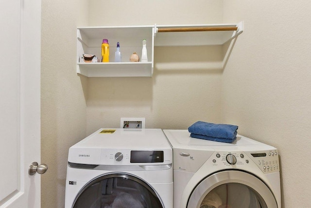 1411 Rowan Dr, Georgetown, TX 78628 - laundry room featuring washing machine and dryer