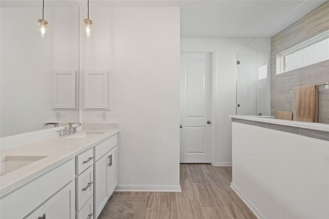 708 Leeward Pass, Leander, TX 78641 - full bathroom with double vanity and walk in shower
