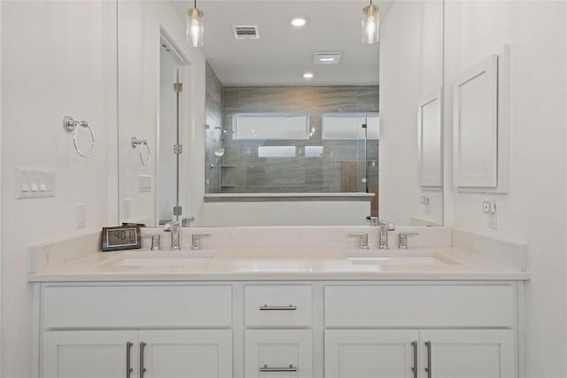 708 Leeward Pass, Leander, TX 78641 - bathroom with double vanity and a stall shower