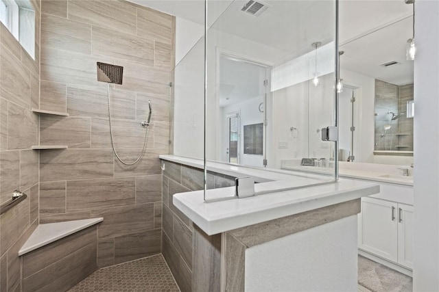 708 Leeward Pass, Leander, TX 78641 - full bathroom featuring a tile shower and vanity