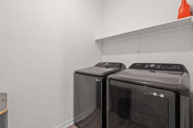 708 Leeward Pass, Leander, TX 78641 - washroom with independent washer and dryer and wood finished floors