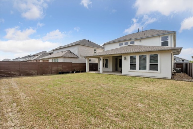 708 Leeward Pass, Leander, TX 78641 - back of property featuring a fenced backyard, a patio area, stucco siding, and a shingled roof