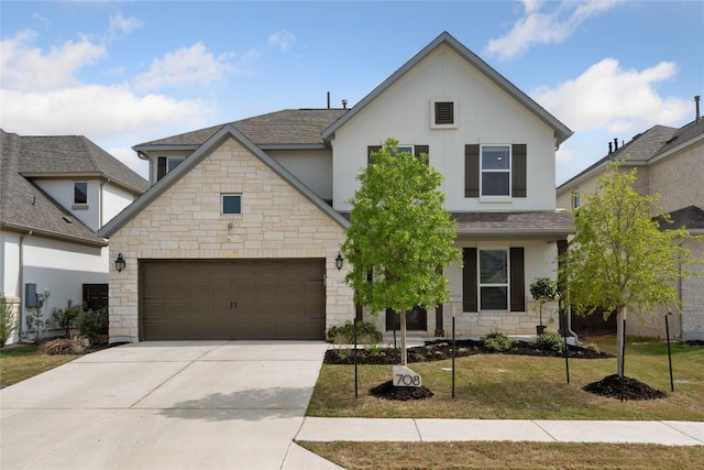 708 Leeward Pass, Leander, TX 78641 - view of front of property with stone siding, concrete driveway, stucco siding, a front lawn, and roof with shingles