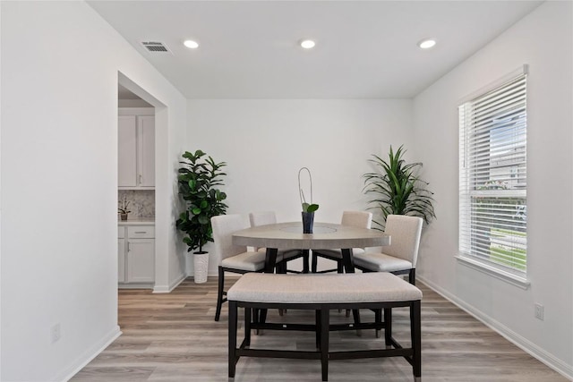 708 Leeward Pass, Leander, TX 78641 - dining room with light wood-style flooring and recessed lighting