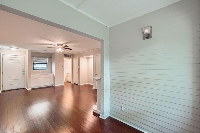 1510 W N Loop Blvd Unit 1024, Austin, TX 78756 - unfurnished living room with dark wood-type flooring, a ceiling fan, and baseboards