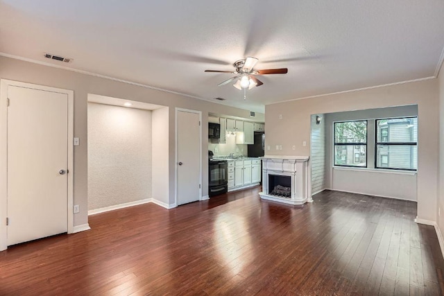 1510 W N Loop Blvd Unit 1024, Austin, TX 78756 - unfurnished living room with ceiling fan, crown molding, dark wood-style flooring, and baseboards