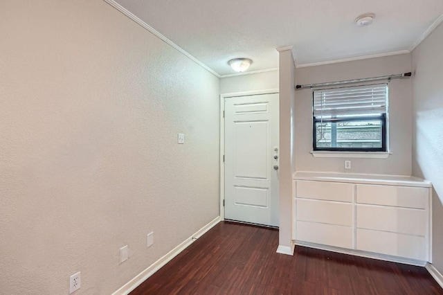 1510 W N Loop Blvd Unit 1024, Austin, TX 78756 - foyer featuring crown molding, dark wood-style flooring, baseboards, and a textured wall