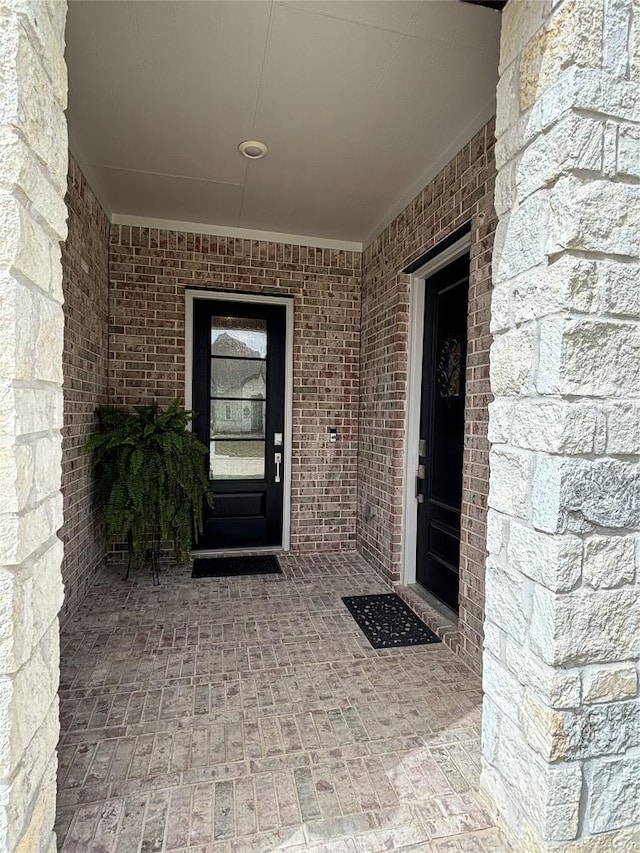 22046 Gateway Arch Dr, Porter, TX 77365 - property entrance featuring brick siding and stone siding
