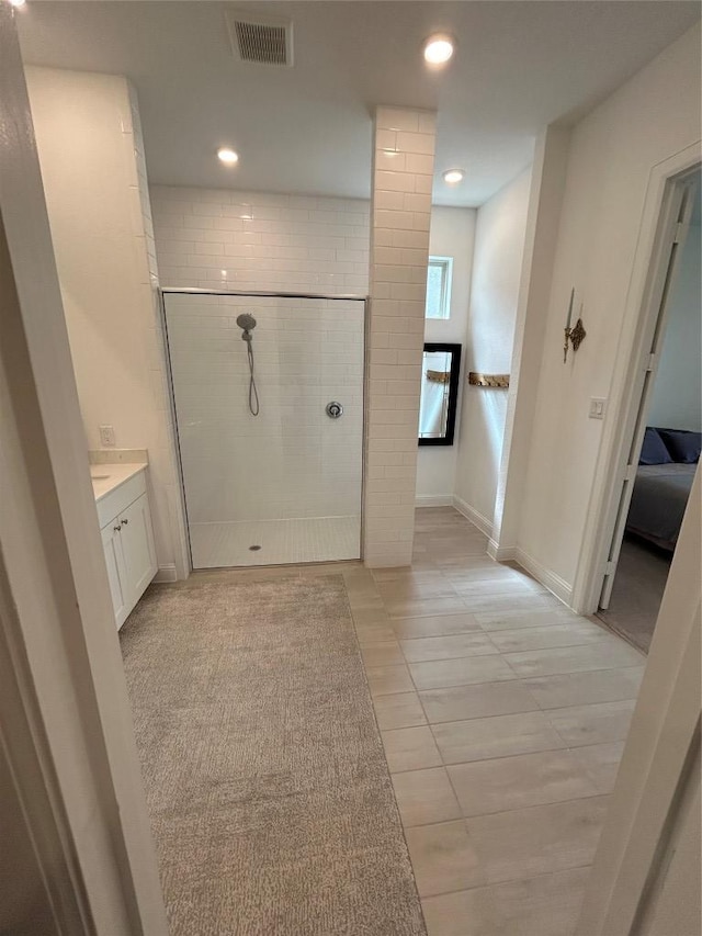 22046 Gateway Arch Dr, Porter, TX 77365 - full bathroom featuring a walk in shower, vanity, tile patterned floors, and recessed lighting