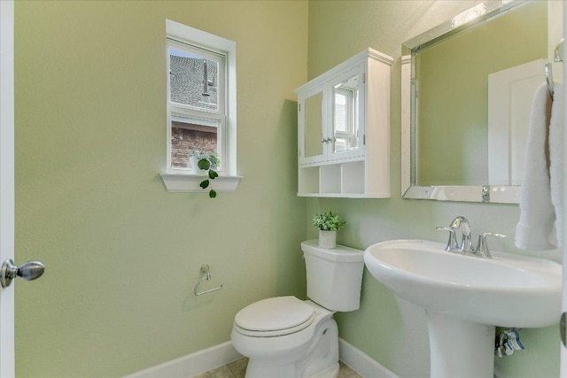 536 Loma Cedro Bnd, Leander, TX 78641 - half bathroom with baseboards and toilet