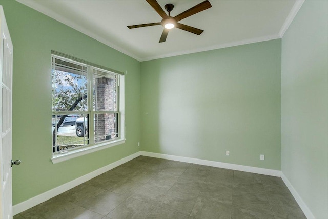 spare room with a ceiling fan, baseboards, and ornamental molding
