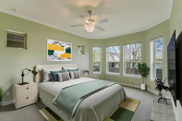 bedroom featuring crown molding, baseboards, and carpet