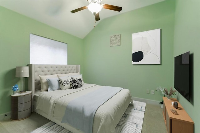 bedroom with baseboards, ceiling fan, vaulted ceiling, and carpet flooring