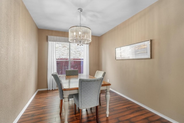 3716 Pine Needle Cir, Round Rock, TX 78681 - dining room with a chandelier, dark wood-style flooring, and baseboards