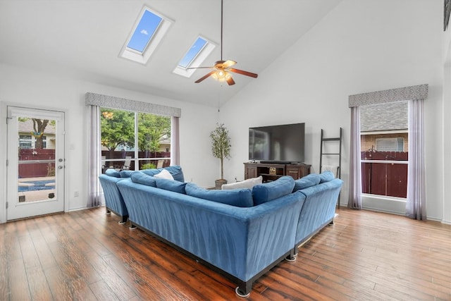 3716 Pine Needle Cir, Round Rock, TX 78681 - living room featuring a ceiling fan, high vaulted ceiling, wood-type flooring, and a skylight