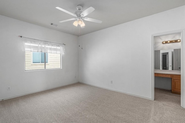 3716 Pine Needle Cir, Round Rock, TX 78681 - unfurnished bedroom with light carpet, ensuite bathroom, a ceiling fan, and baseboards