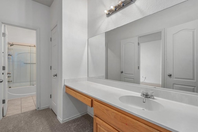 3716 Pine Needle Cir, Round Rock, TX 78681 - bathroom with vanity, bathing tub / shower combination, tile patterned flooring, and baseboards