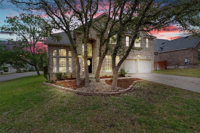 318 Ridge Run Dr, Georgetown, TX 78628 - traditional-style home featuring concrete driveway, an attached garage, a lawn, and brick siding