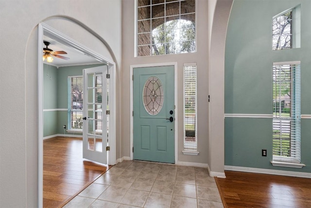 318 Ridge Run Dr, Georgetown, TX 78628 - entryway with wood-type flooring, a ceiling fan, healthy amount of natural light, arched walkways, and a high ceiling