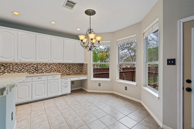 318 Ridge Run Dr, Georgetown, TX 78628 - unfurnished dining area with a chandelier, light tile patterned floors, recessed lighting, and baseboards