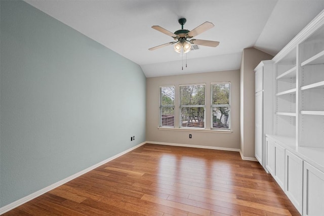 318 Ridge Run Dr, Georgetown, TX 78628 - spare room featuring lofted ceiling, light wood-style flooring, ceiling fan, and baseboards