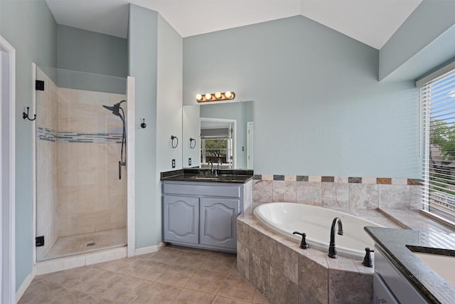 318 Ridge Run Dr, Georgetown, TX 78628 - bathroom with a shower stall, vanity, a bath, lofted ceiling, and tile patterned floors