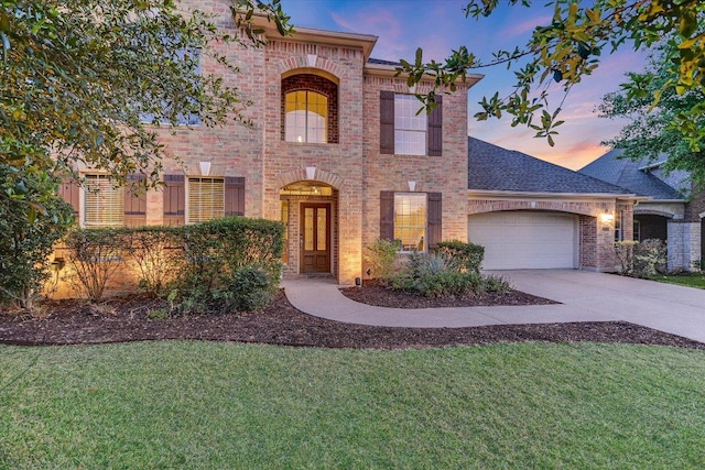 431 Ridgetop Bnd, Cedar Park, TX 78613 - view of front facade featuring brick siding, an attached garage, concrete driveway, a front lawn, and a shingled roof