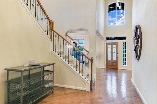 431 Ridgetop Bnd, Cedar Park, TX 78613 - entryway featuring plenty of natural light, baseboards, wood finished floors, stairs, and a towering ceiling