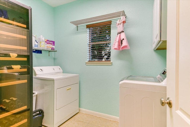 431 Ridgetop Bnd, Cedar Park, TX 78613 - washroom featuring washing machine and clothes dryer, baseboards, cabinet space, and light tile patterned flooring