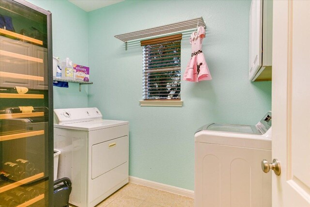 431 Ridgetop Bnd, Cedar Park, TX 78613 - washroom featuring washing machine and clothes dryer, baseboards, cabinet space, and light tile patterned flooring