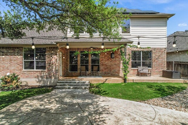 431 Ridgetop Bnd, Cedar Park, TX 78613 - back of house with brick siding, solar panels, cooling unit, and a patio